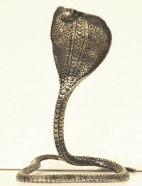 Small silver ornament in the form of a Cobra snake within Hull's silver collections