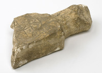 Medieval chalk ingot mould carved on one side to form a gaming board, excavated from Beverley.