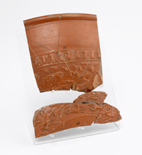 Samian bowl with images of a stag, lion, bear and a man on horseback